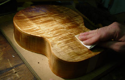 applying finish to back of baritone ukulele