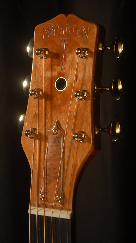 front view of the headstock of michael mccarten's 000-12 flat top guitar model