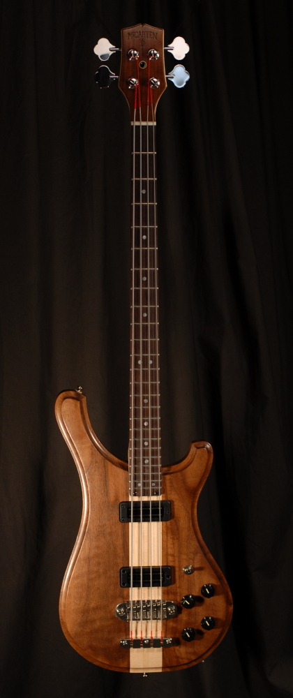 front view of michael mccarten's double cutaway electric bass guitar model