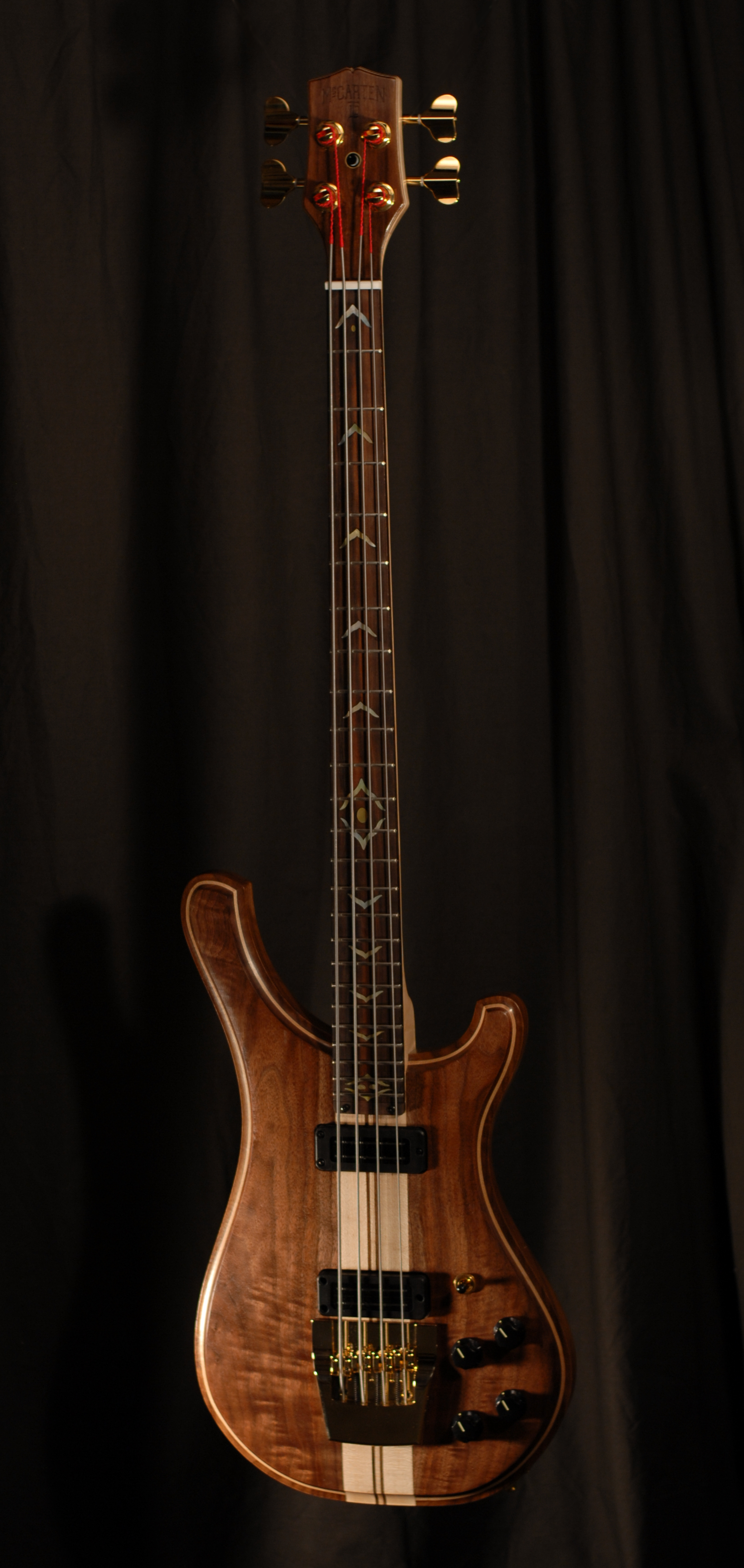 front view of michael mccarten's double cutaway electric bass guitar model